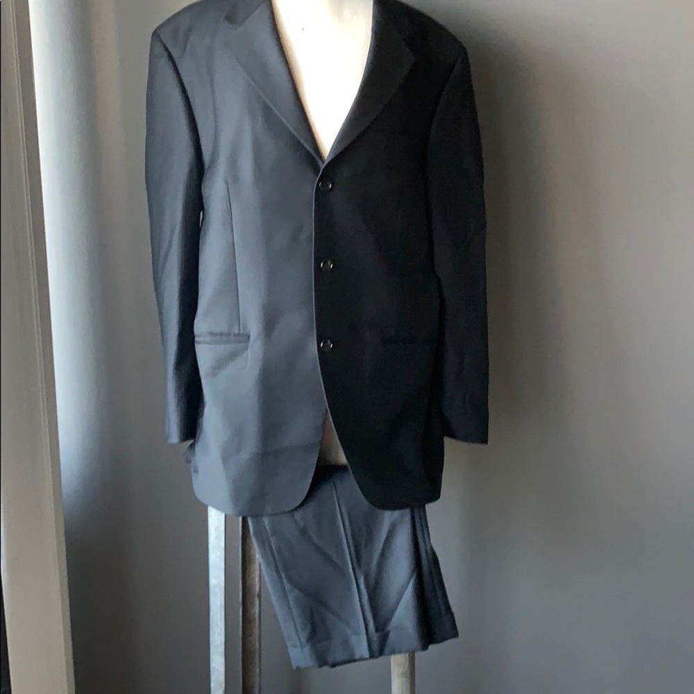 Black on black pinstripe suit